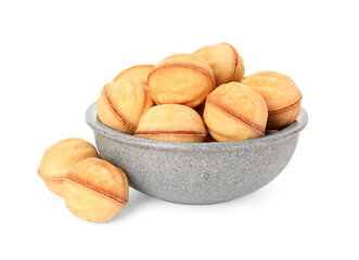 Bowl of delicious nut shaped cookies with condensed milk on white background