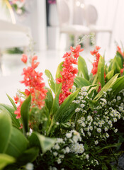 a collection of fake flowers or decorative flowers at weddings, pink, white, green, red flowers and others