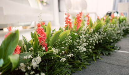 a collection of fake flowers or decorative flowers at weddings, pink, white, green, red flowers and others