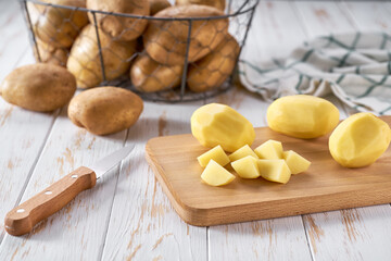 Raw yellow organic potatoes ready to cook.