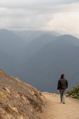 Obraz premium Young caucasian woman hikes at Hurricane Ridge in Olympic National Park in Washington State.
