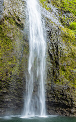Fototapeta na wymiar Hanakapiai Falls Into Hanakapiai Stream Deep Inside Hanakapiai Valley, Kauai, Hawaii, USA