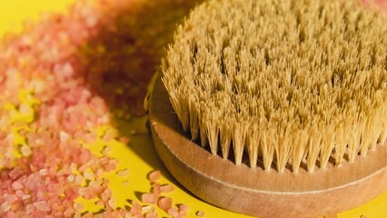 Zoom in out Dry massage brush with natural bristle, ecological cosmetics, home care. Natural sea salt Bamboo Brush for dry anti-cellulite massage. Spa beauty concept skin massage - Powered by Adobe