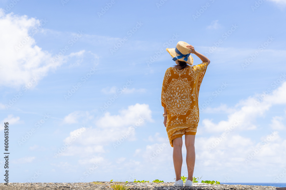 Wall mural Woman enjoy the sea view