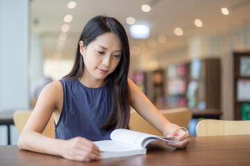 Woman read the book in library
