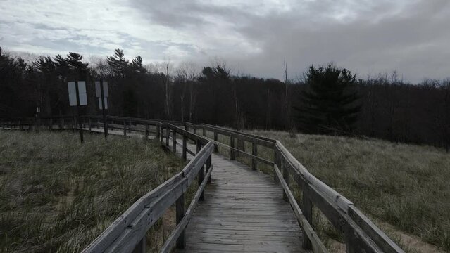 Stormy weather over a boardwalk. point of View track forward.
