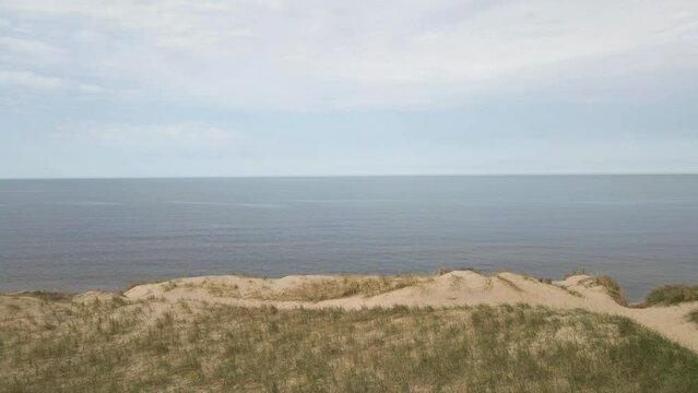 Dolling backwards from the edge of the dunes.