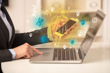 Doctor working on laptop with healthcare concept