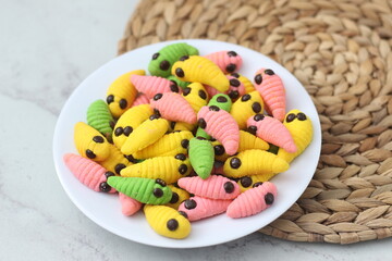 caterpillar cake with various colors.