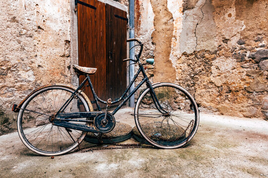 Abandoned vintage bicycle at street of old town of Lovran in Croatia
