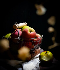 In the frame ripe red apples against black background 