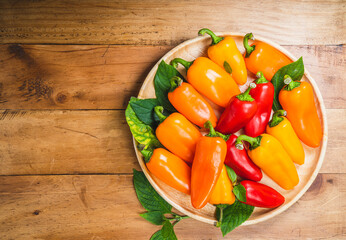 Mixed Color Sweet bite Peppers  or Bell pepper on wooden  background.