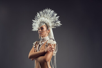 portrait topless woman in pearl carnival costume