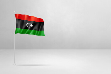 Libyan flag isolated on white concrete wall background