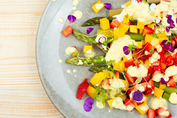 Tasty fruit salad with asparagus.