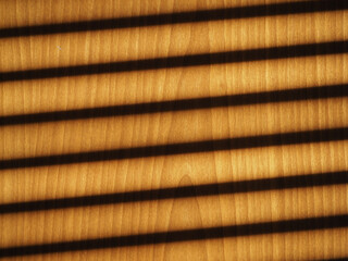 blinds shadow on wooden wall background