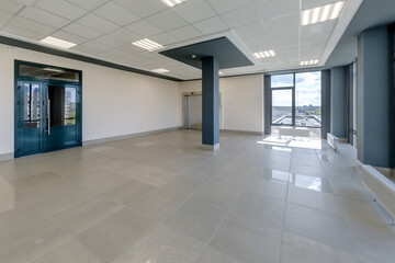 empty modern hall room with columns, doors and panoramic windows.