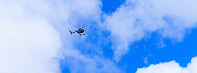 helicopter in the sky with cloud