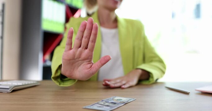 Woman manager or seo refuses to accept bribery. Concept of business corruption