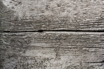 Obraz premium The pattern and texture of an old weathered wooden wall