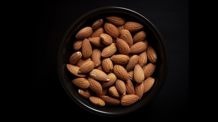  a bowl filled with almonds on a black table top.  generative ai