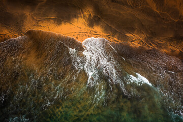 Flying over the waves of the sea at Otur beach. Asturias. Spain.