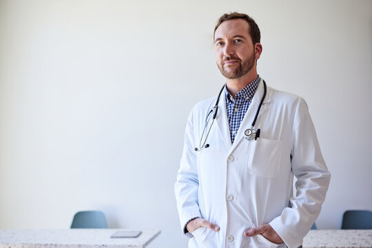 Portrait of male healthcare worker with hands in pockets