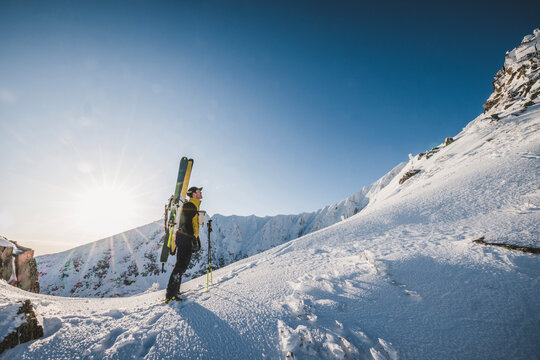 Backcountry skier takes in the the snowy view, Katahdin, Maine