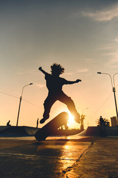 Skateboarder in action. Boy making skate air trick with grab