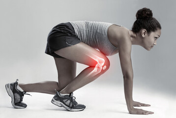 Woman, running and start with knee x ray for injury, workout or sport accident against a gray studio background. Female runner in skeleton pain with sore leg, ache or bone from exercising or training
