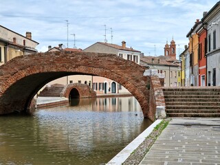 View of Comacchio, Italy, on the Adriatic coast, famous for bridge (tourism) and for its eel fishing - antennas on roofs