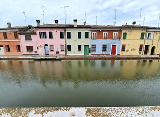 Fototapeta na wymiar View of Comacchio, Italy, on the Adriatic coast, famous for bridge (tourism) and for its eel fishing - antennas on roofs