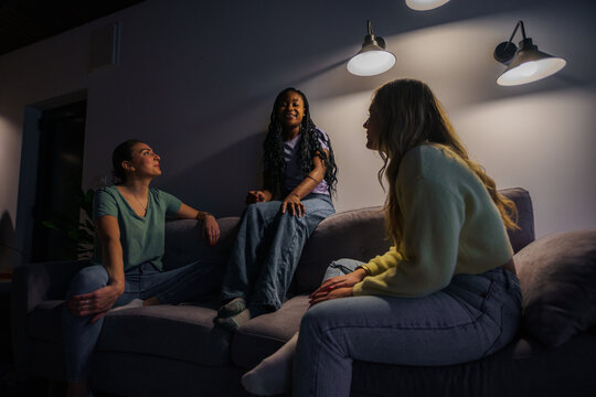 Three Happy Young Adult Women Hanging Out In The Evening