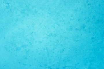 Blue light concrete texture for background in summer wallpaper. Cyan cement colour sand wall of tone vintage. Abstract teal dark color.
