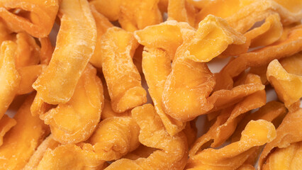 Dried melon slices isolated on a white background.