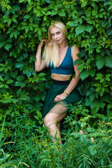 Beautiful fashion blonde model enjoying nature