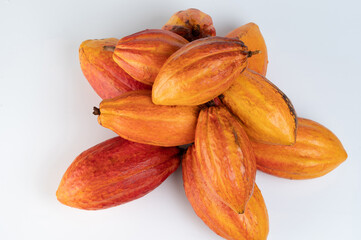Stack of orange color cacao pods