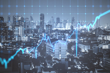 Glowing blue business graph on blurry city backdrop. Finance, trade and success concept. Double exposure.