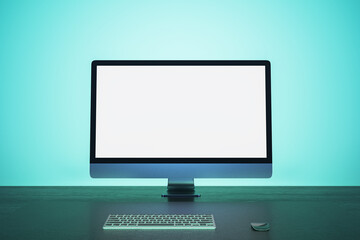 Abstract blue workplace with empty white mock up computer screen. Office concept. 3D Rendering.