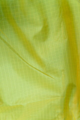 Green soft synthetic ripstop fabric as texture, pattern, background