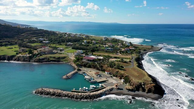 Small local harbor with colorful fishing boats at Pomos,Cyprus. Aerial view of Pomos fishermans harbour in Cyprus.