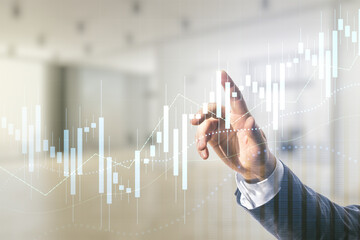 Double exposure of man hand clicks on abstract creative financial chart hologram on blurred office background, research and strategy concept