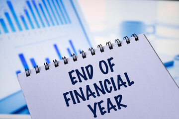 Notepads with the inscription END OF FINANCIAL YEAR. Business concept