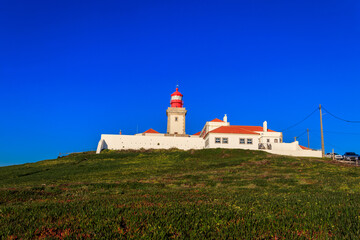 Lighthouse on the cliff at Cabo da Roca. Cabo da Roca or Cape Roca is westernmost cape of mainland Portugal, continental Europe and the Eurasian land mass