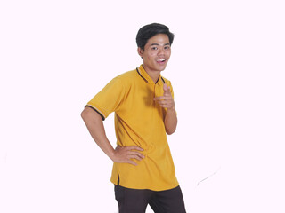 Side view of Adult Asian man smiling happy while pointing finger forward
