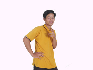 Side view of Adult Asian man smiling happy while pointing finger forward
