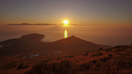 Fototapeta na wymiar Sunrise in Molos beach. Paros island Greece.