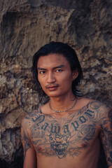 Surfing Outdoor Sport Activities Asian Male with Tattoos 
