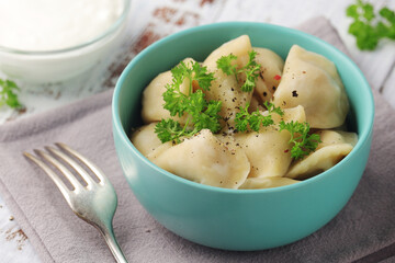 Russian national dish pelmeni served in a plate