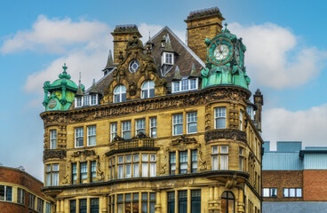 Emerson Chambers building in Newcastle City Centre featuring a copper enclosed clock on top.